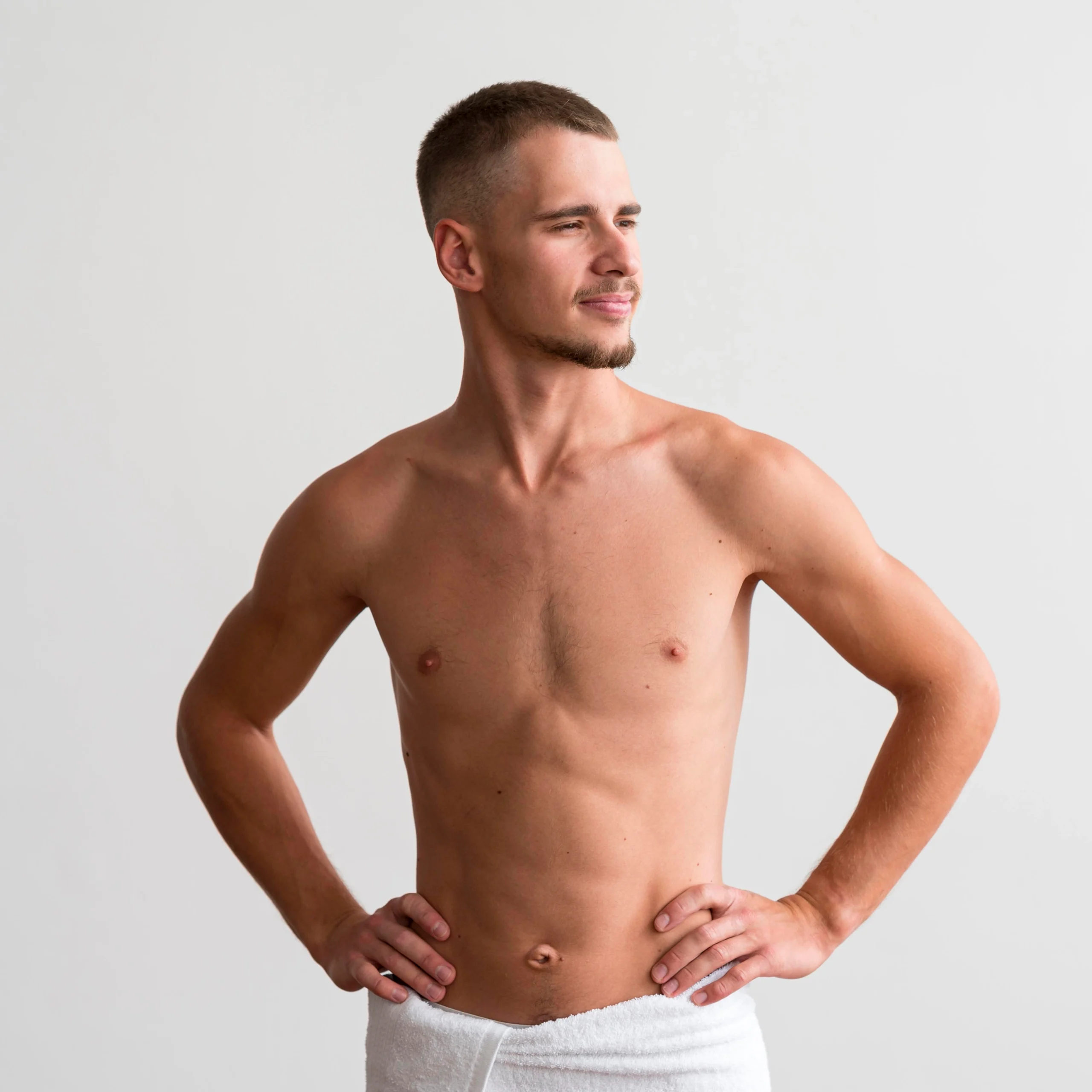 Postoperative anterior view of a male patient following glandular excision and suction-assisted lipectomy for gynecomastia surgery uk.