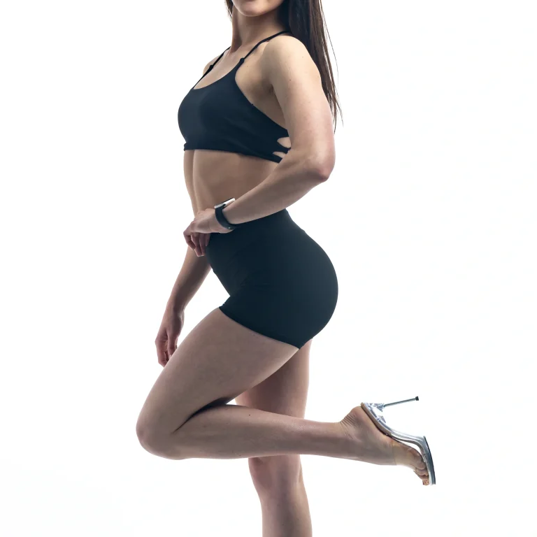 fit-woman-posing-activewear-heels